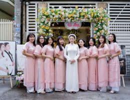 Áo dài bưng quả hoa mộc miên màu hồng